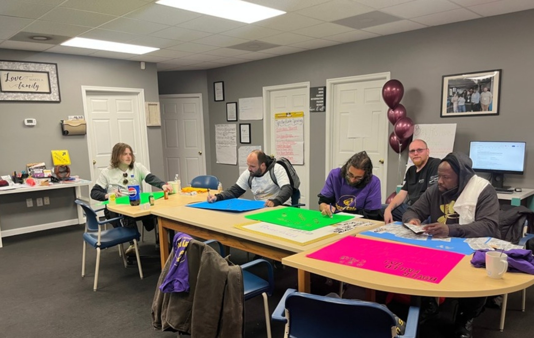 Participants working together at Network Connect's Recovery Café