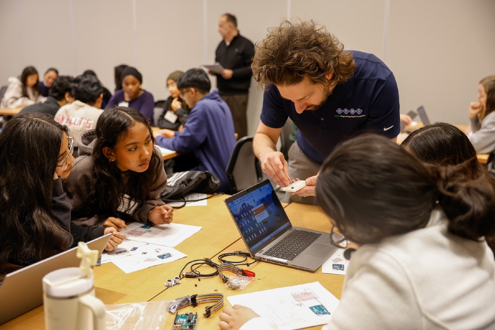 High school students working through a hands-on workshop at Youth STEAM and Startup Day